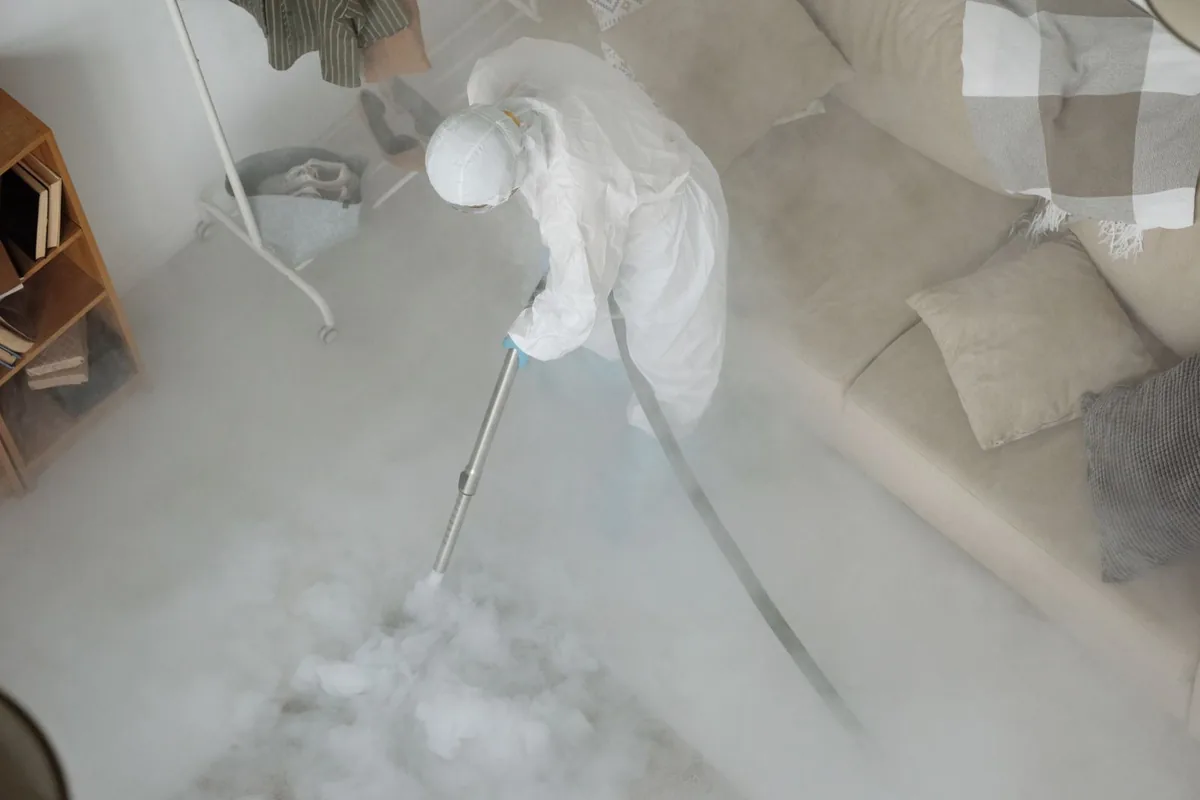 Biohazard cleanup technician in protective equipment, Lockeford, CA